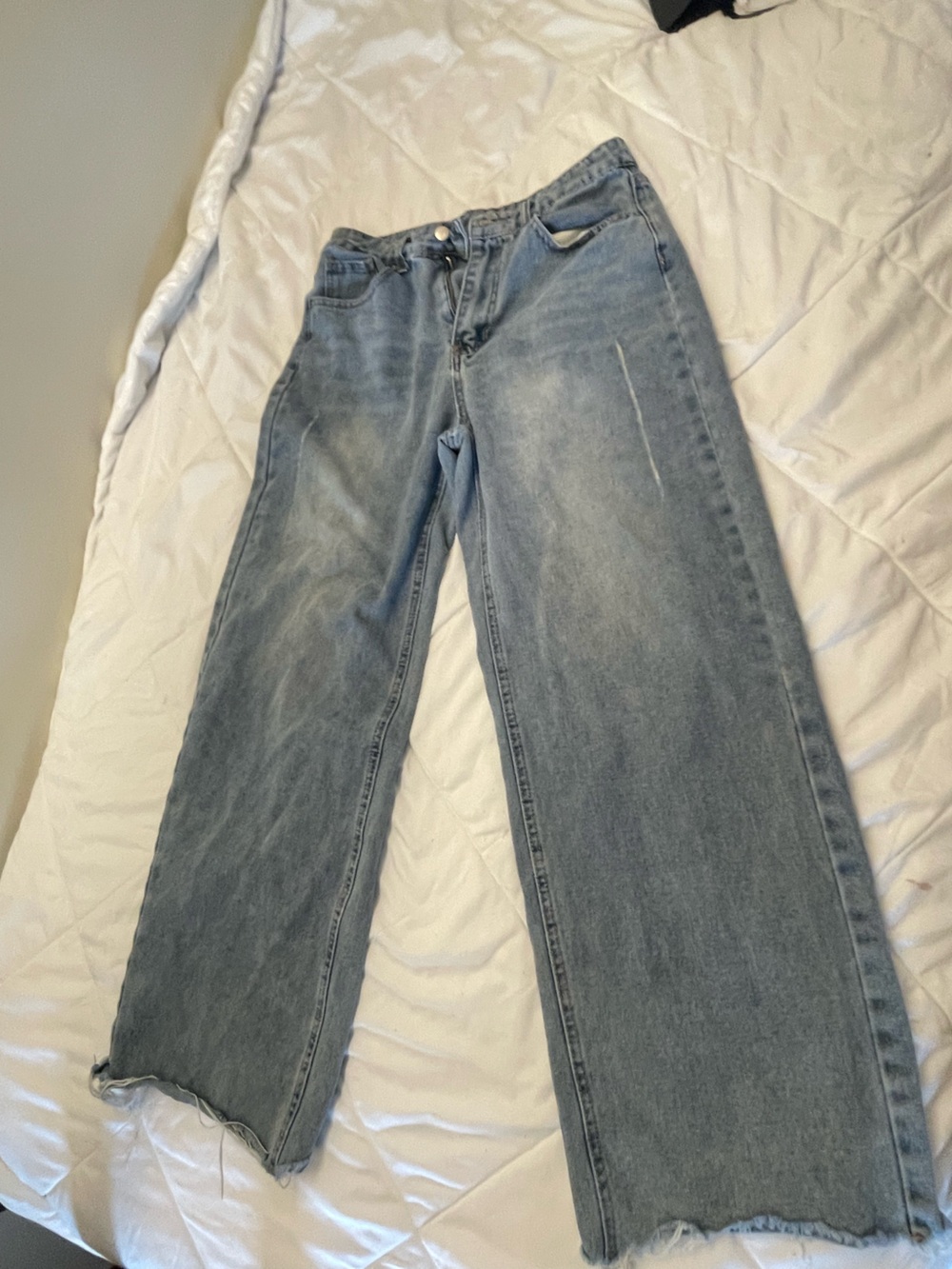 High-waisted, wide-leg blue jeans with a relaxed fit